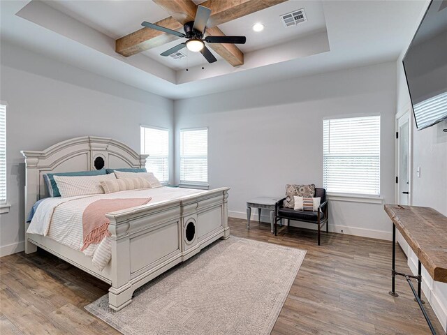 1614 S 1st Ave, Stroud, OK 74079 - bedroom featuring wood finished floors, baseboards, beamed ceiling, ceiling fan, and recessed lighting