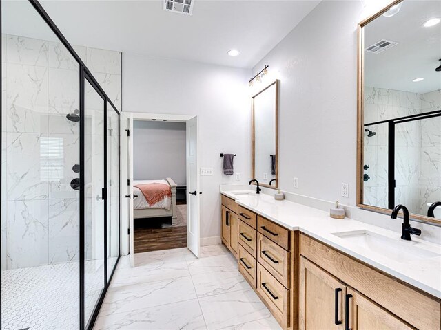 1614 S 1st Ave, Stroud, OK 74079 - full bath featuring marble look tile flooring, a marble finish shower, double vanity, ensuite bathroom, and recessed lighting