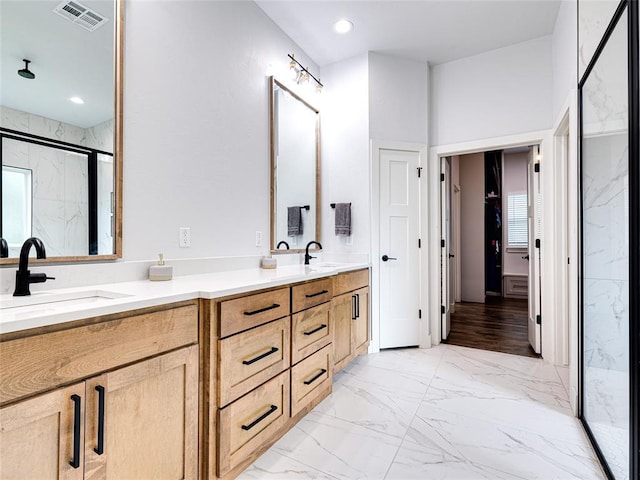 1614 S 1st Ave, Stroud, OK 74079 - bathroom featuring a marble finish shower, marble look tiles, and double vanity