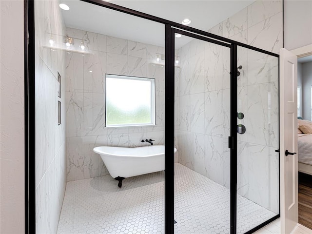 1614 S 1st Ave, Stroud, OK 74079 - ensuite bathroom with a marble finish shower, a freestanding tub, and recessed lighting
