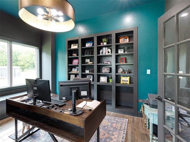 1614 S 1st Ave, Stroud, OK 74079 - office with wood finished floors and a textured wall