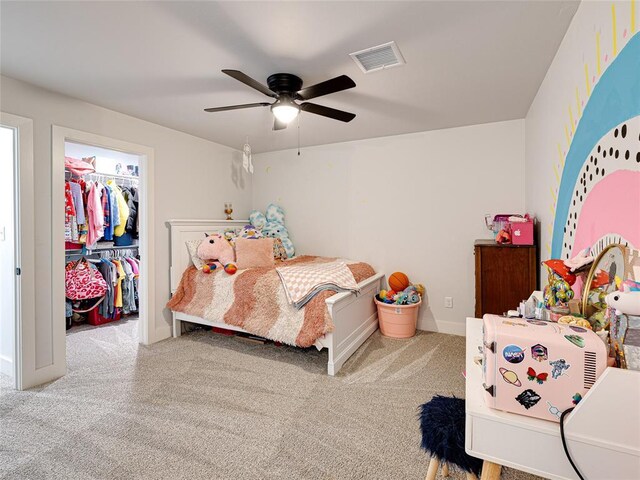 1614 S 1st Ave, Stroud, OK 74079 - bedroom featuring carpet floors, a walk in closet, a ceiling fan, and baseboards