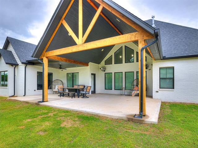 1614 S 1st Ave, Stroud, OK 74079 - rear view of house with brick siding, a yard, a ceiling fan, and a patio area