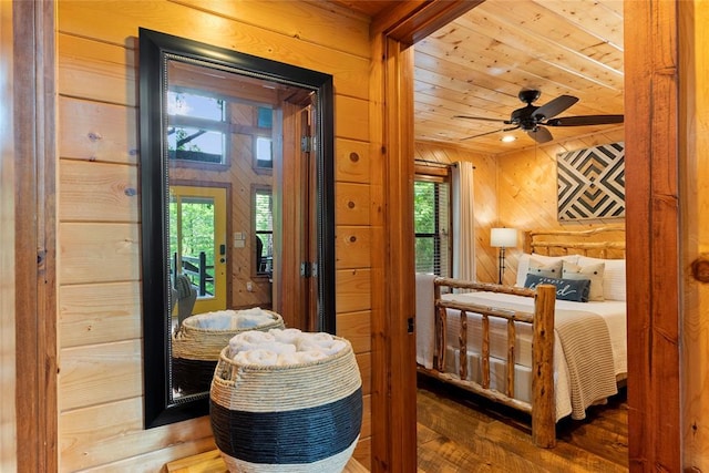 962 Red Fox Rd, Broken Bow, OK 74728 - bedroom featuring wooden walls, wooden ceiling, multiple windows, and wood finished floors