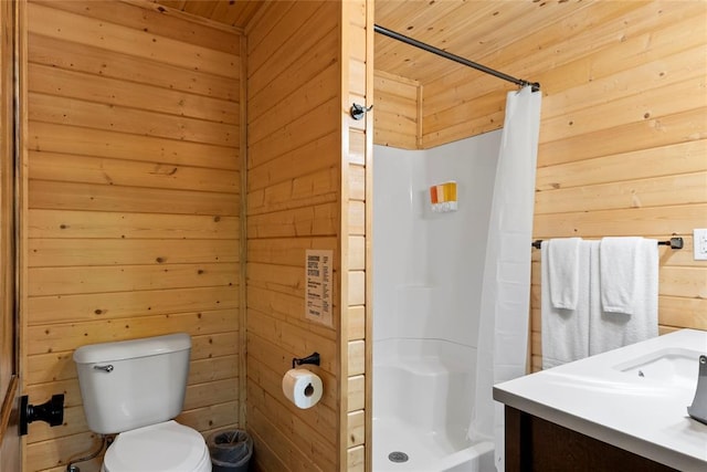 962 Red Fox Rd, Broken Bow, OK 74728 - full bathroom with a stall shower, wood walls, wood ceiling, toilet, and vanity