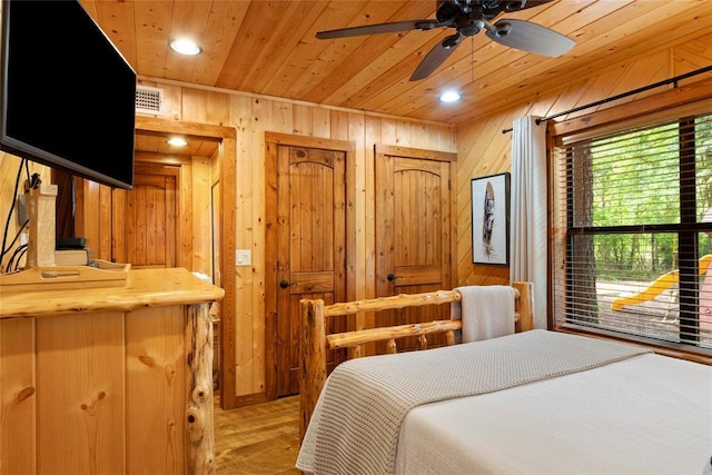 962 Red Fox Rd, Broken Bow, OK 74728 - bedroom with wood ceiling, wooden walls, light wood-type flooring, and recessed lighting