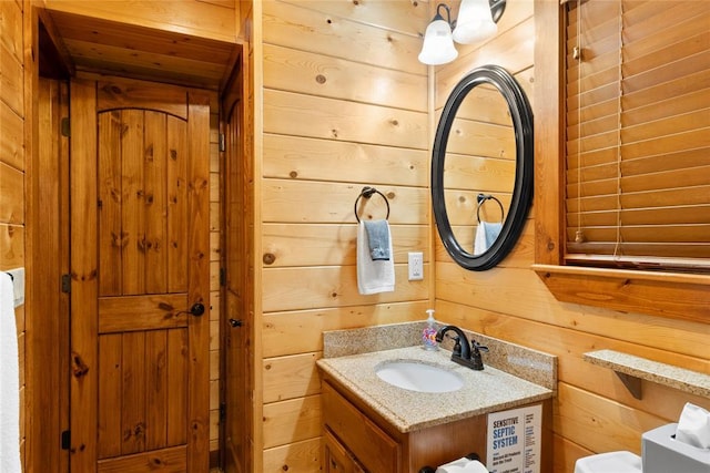 962 Red Fox Rd, Broken Bow, OK 74728 - bathroom with wood walls and vanity