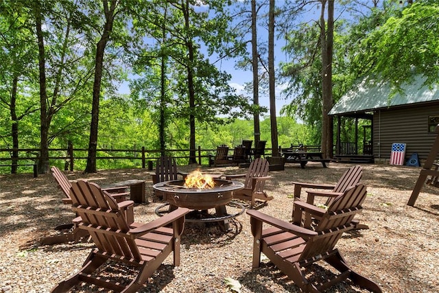 962 Red Fox Rd, Broken Bow, OK 74728 - view of patio / terrace featuring an outdoor fire pit