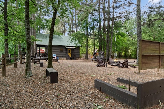 962 Red Fox Rd, Broken Bow, OK 74728 - view of yard with a fire pit