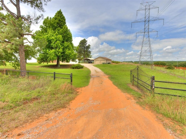 13776 E Stella Rd, Newalla, OK 74857 - view of dirt / gravel road with a gated entry and a view of countryside