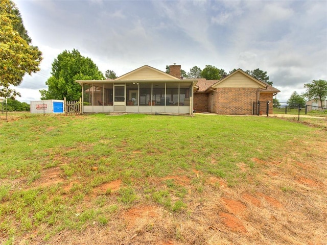 13776 E Stella Rd, Newalla, OK 74857 - rear view of property with a sunroom, a chimney, and brick siding