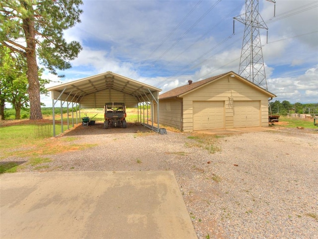 13776 E Stella Rd, Newalla, OK 74857 - detached garage featuring a carport and driveway