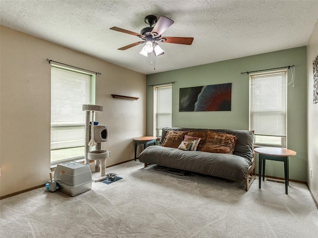 13776 E Stella Rd, Newalla, OK 74857 - living area with a ceiling fan, carpet floors, a textured ceiling, and baseboards