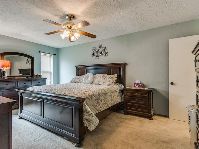 13776 E Stella Rd, Newalla, OK 74857 - bedroom featuring light colored carpet, a textured ceiling, and a ceiling fan