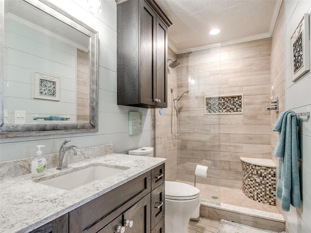 13776 E Stella Rd, Newalla, OK 74857 - full bath with toilet, crown molding, vanity, a tile shower, and a textured ceiling