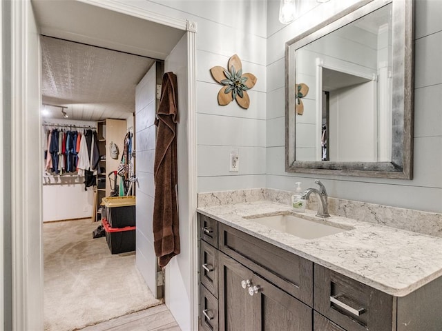 13776 E Stella Rd, Newalla, OK 74857 - bathroom with vanity and a walk in closet