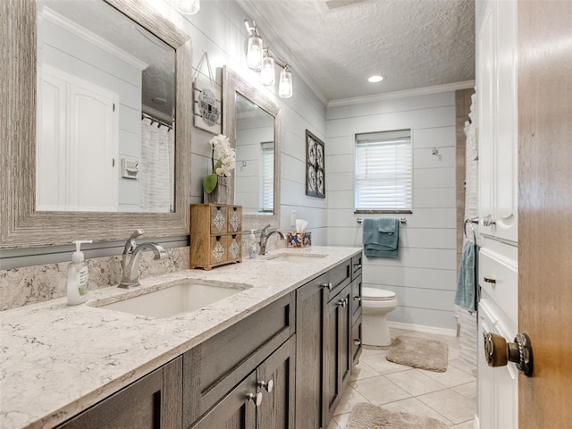 13776 E Stella Rd, Newalla, OK 74857 - bathroom with ornamental molding, double vanity, a textured ceiling, toilet, and tile patterned flooring