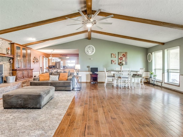 13776 E Stella Rd, Newalla, OK 74857 - living room featuring hardwood / wood-style flooring, a ceiling fan, and a textured ceiling