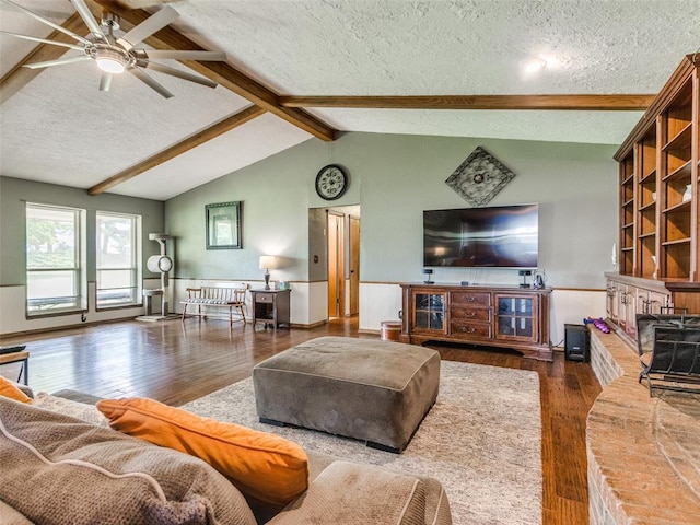 13776 E Stella Rd, Newalla, OK 74857 - living area featuring a textured ceiling, hardwood / wood-style floors, wainscoting, and a ceiling fan