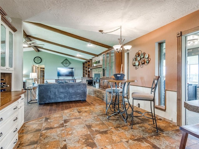 13776 E Stella Rd, Newalla, OK 74857 - dining room featuring a textured ceiling, a ceiling fan, and stone finish floors