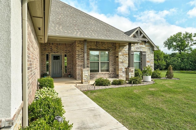 12535 Memory Ln, Edmond, OK 73025 - doorway to property featuring a shingled roof, a yard, and brick siding