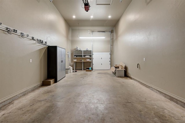 12535 Memory Ln, Edmond, OK 73025 - garage featuring baseboards and a garage door opener