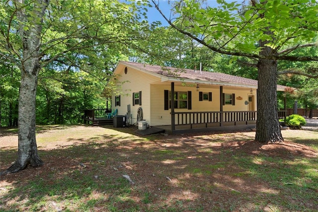 868 Red Fox Rd, Broken Bow, OK 74728 - ranch-style house featuring central AC and a deck