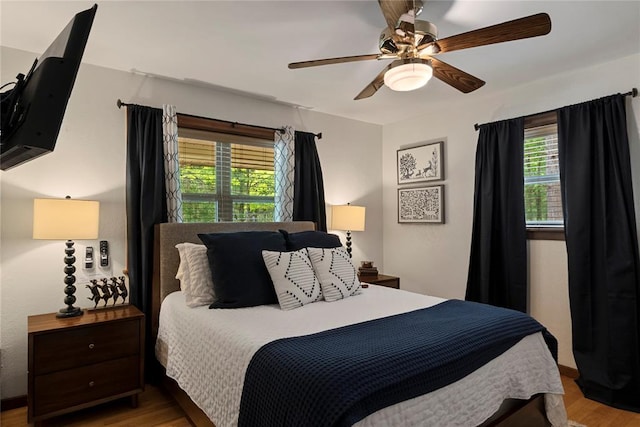 868 Red Fox Rd, Broken Bow, OK 74728 - bedroom with wood finished floors and a ceiling fan