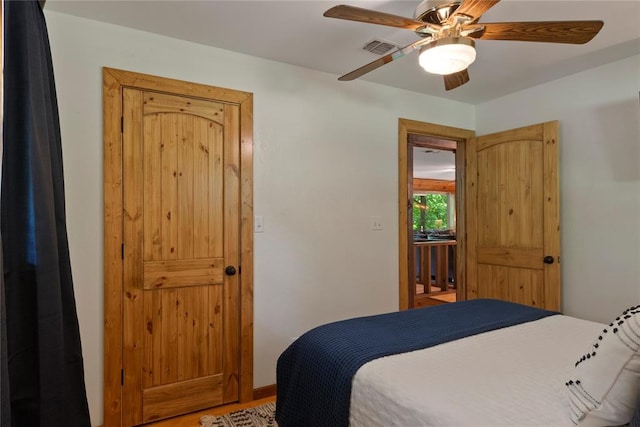 868 Red Fox Rd, Broken Bow, OK 74728 - bedroom featuring ceiling fan and light wood finished floors