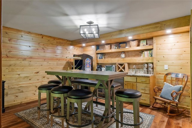 868 Red Fox Rd, Broken Bow, OK 74728 - indoor wet bar featuring wood walls and wood finished floors