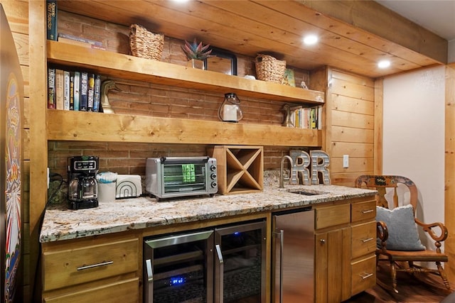868 Red Fox Rd, Broken Bow, OK 74728 - indoor bar with stainless steel fridge, recessed lighting, beverage cooler, and wood finished floors