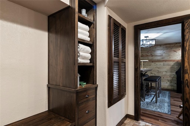 868 Red Fox Rd, Broken Bow, OK 74728 - hall with wood finished floors and a textured wall