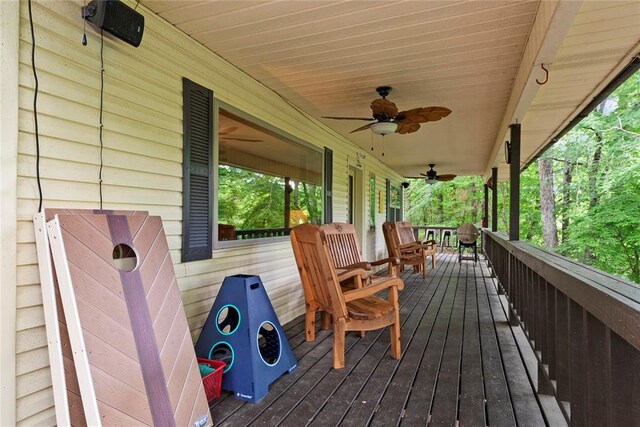 868 Red Fox Rd, Broken Bow, OK 74728 - deck featuring covered porch and a ceiling fan