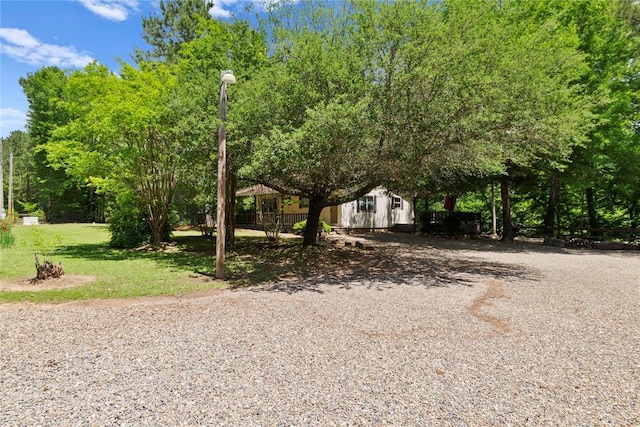 868 Red Fox Rd, Broken Bow, OK 74728 - view of front of house with driveway and a front yard
