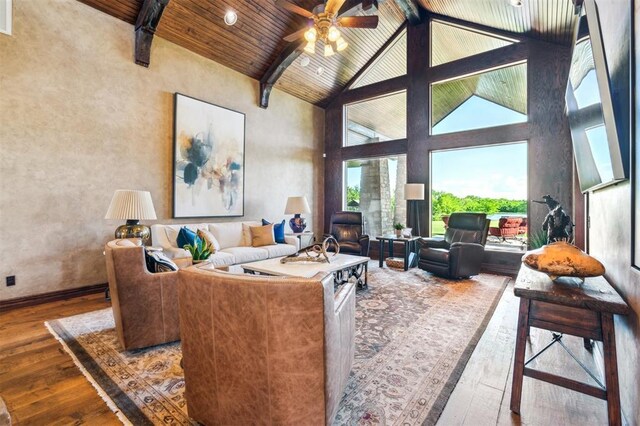 13600 W Britton Rd, Yukon, OK 73099 - living area featuring wood-type flooring, ceiling fan, high vaulted ceiling, wood ceiling with exposed beams, and baseboards