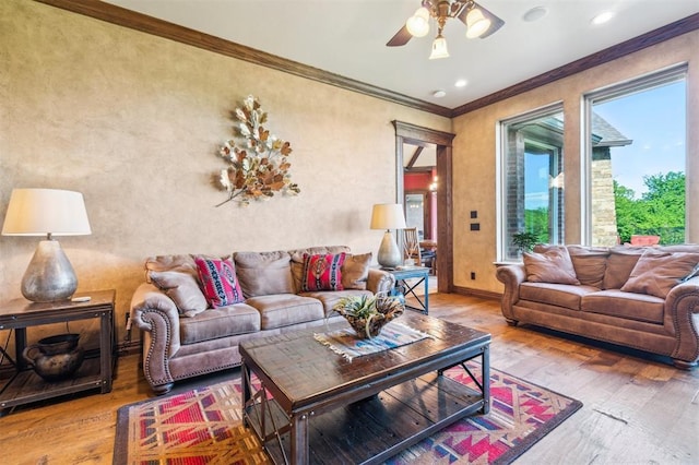13600 W Britton Rd, Yukon, OK 73099 - living area featuring wood finished floors, ornamental molding, ceiling fan, baseboards, and recessed lighting