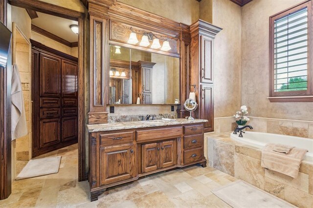 13600 W Britton Rd, Yukon, OK 73099 - bathroom featuring stone tile flooring, a bath, and vanity