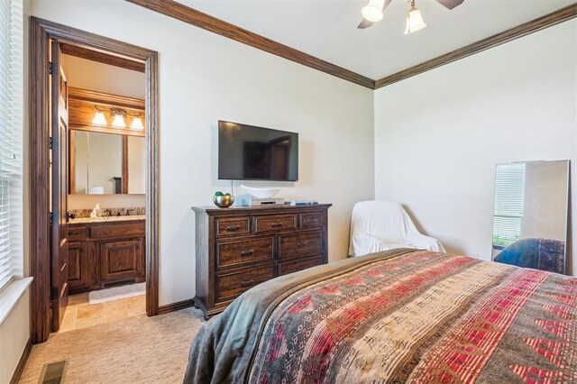 13600 W Britton Rd, Yukon, OK 73099 - bedroom featuring ornamental molding, ensuite bath, ceiling fan, and light colored carpet