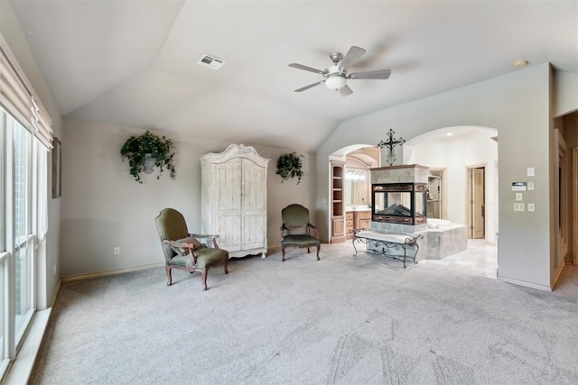 20180 Elm St, Harrah, OK 73045 - living room with arched walkways, a ceiling fan, carpet, lofted ceiling, and baseboards