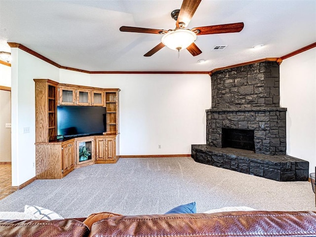 349412 E 840th Rd, Stroud, OK 74079 - living room featuring ceiling fan, baseboards, carpet, crown molding, and a stone fireplace