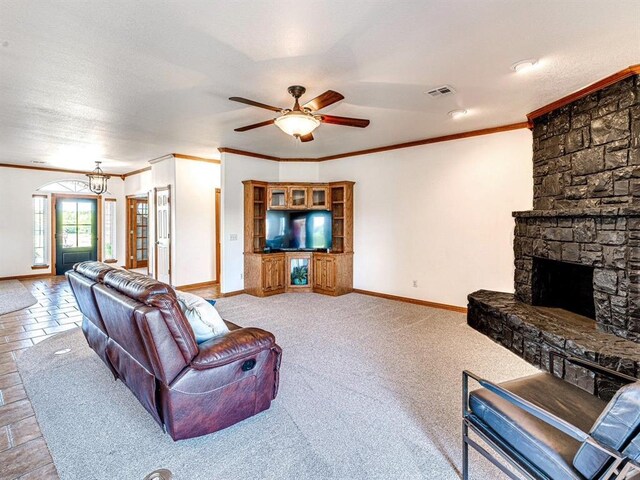 349412 E 840th Rd, Stroud, OK 74079 - living room with crown molding, baseboards, ceiling fan, and a fireplace