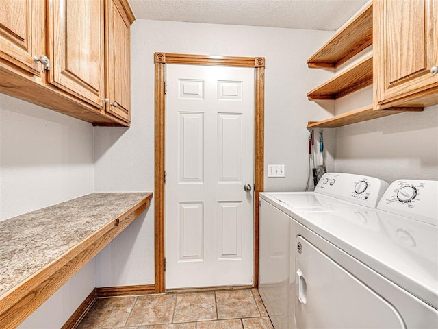 349412 E 840th Rd, Stroud, OK 74079 - laundry area with washing machine and clothes dryer, cabinet space, and baseboards