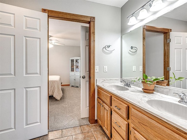 349412 E 840th Rd, Stroud, OK 74079 - ensuite bathroom with double vanity, a ceiling fan, and tile patterned floors