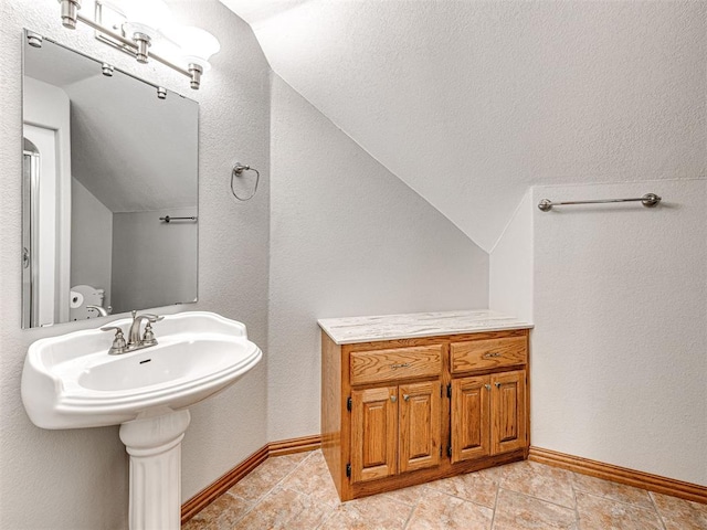 349412 E 840th Rd, Stroud, OK 74079 - bathroom with vaulted ceiling, baseboards, and tile patterned floors