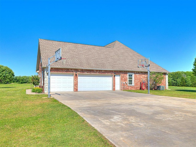 349412 E 840th Rd, Stroud, OK 74079 - view of side of property featuring a garage, a yard, a shingled roof, and driveway