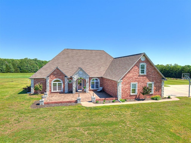 349412 E 840th Rd, Stroud, OK 74079 - view of front facade featuring a front lawn, brick siding, and a shingled roof