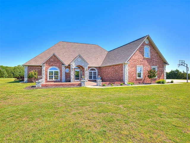 349412 E 840th Rd, Stroud, OK 74079 - view of front of house with brick siding, a front yard, and roof with shingles