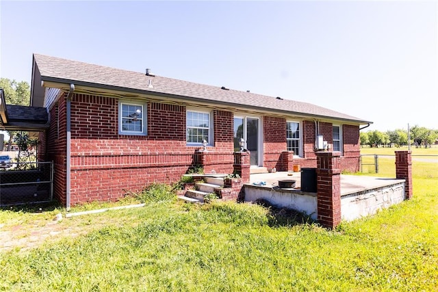 4620 SE 139th St, Oklahoma City, OK 73165 - rear view of property with brick siding, roof with shingles, and a patio