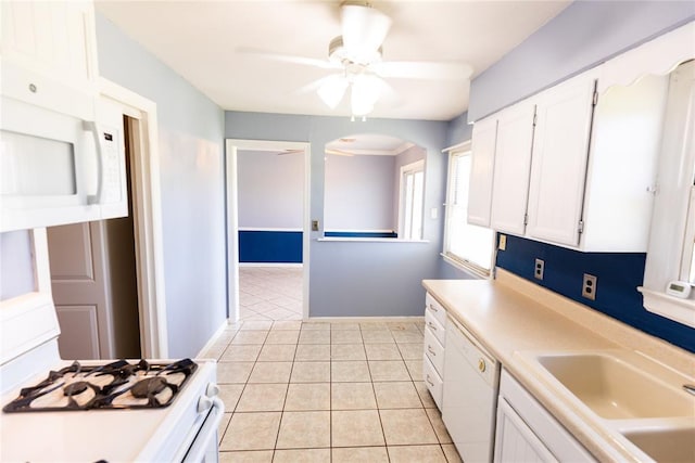 4620 SE 139th St, Oklahoma City, OK 73165 - kitchen with white appliances, white cabinets, light countertops, a sink, and a ceiling fan