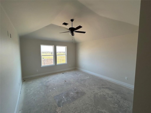 empty room featuring a ceiling fan, lofted ceiling, and baseboards